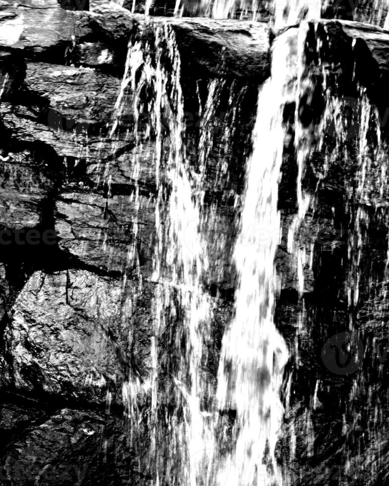 Waterfall and the mountain river background. Waterscape natural environment black and white photo background
