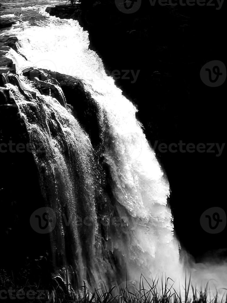 Waterfall and the mountain river background. Waterscape natural environment black and white photo background