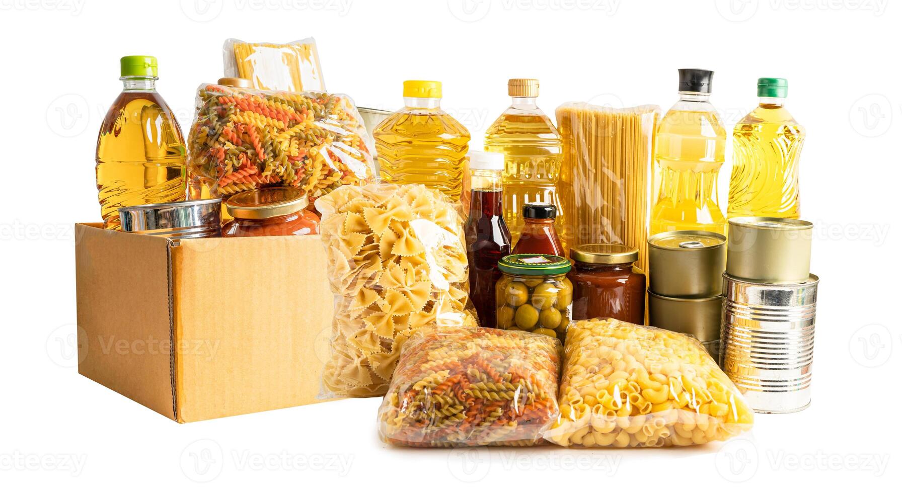 Foodstuff for donation, storage and delivery. Various food, pasta, cooking oil and canned food in cardboard box. photo