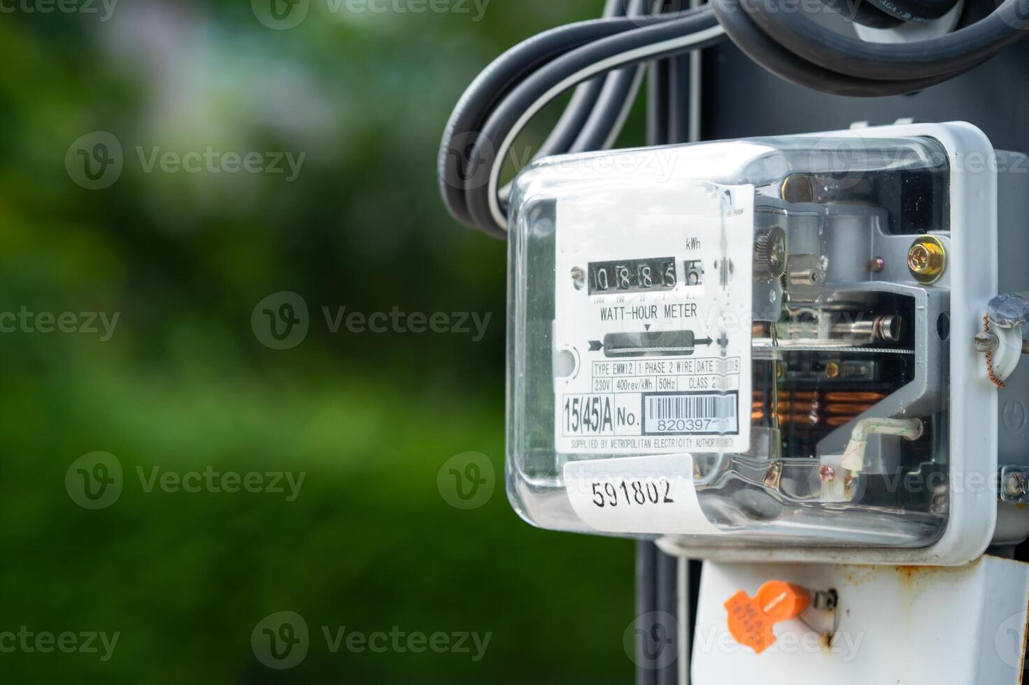 Electric measuring power meter for energy cost at home and office, solar cell concept. photo