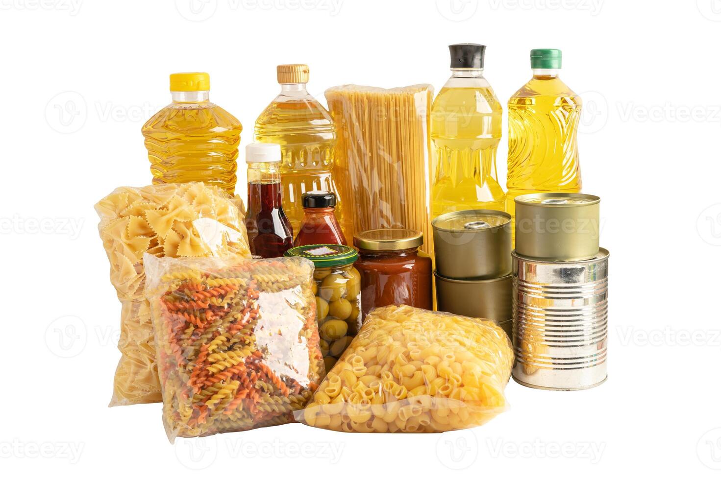 Foodstuff for donation isolated on white background with clipping path, storage and delivery. Various food, pasta, cooking oil and canned food in cardboard box. photo
