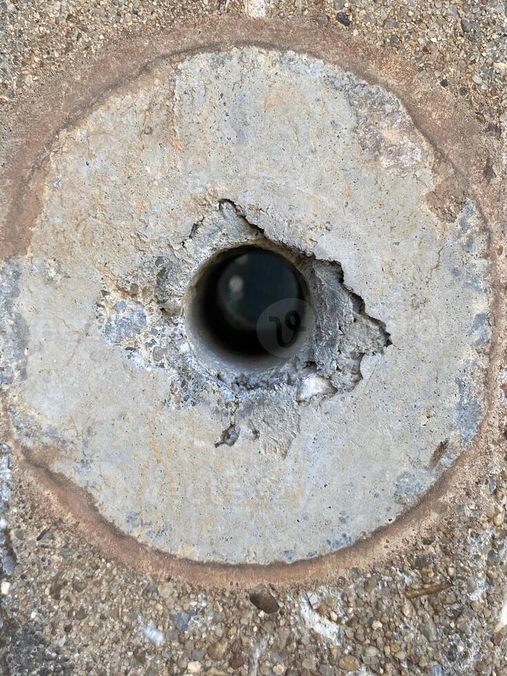 hole in a concrete wall photo
