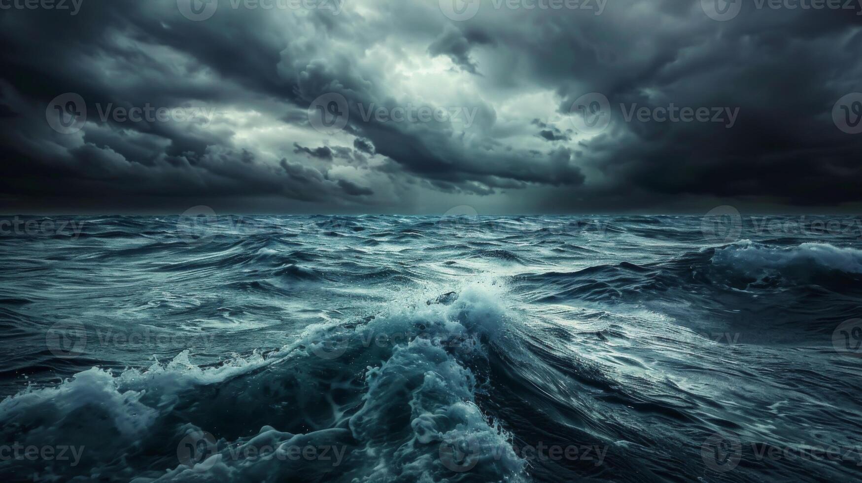 A stormy ocean with large waves crashing against the shore photo