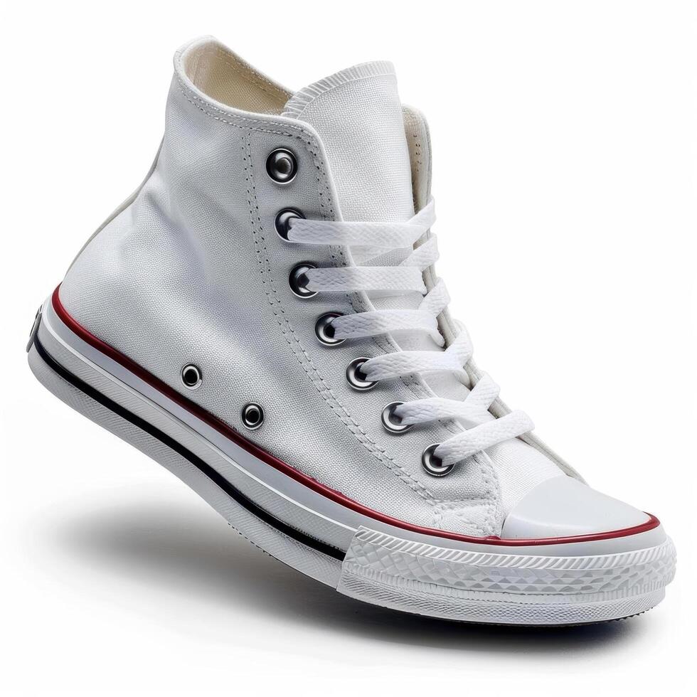 White canvas high top sneakers with red trim. photo
