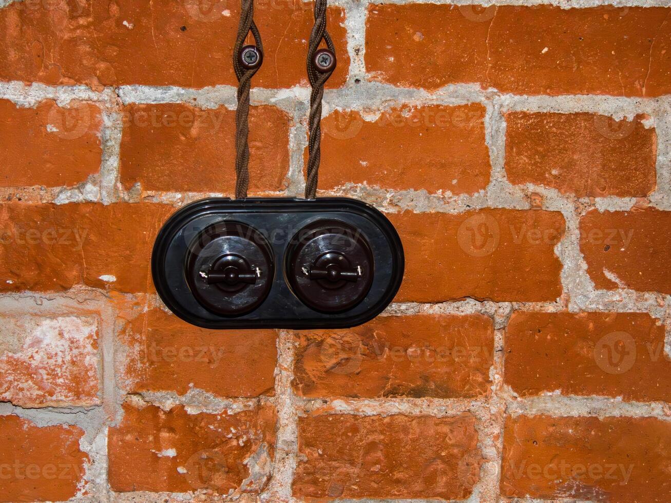 retro switch in a loft interior on a bricks wall photo