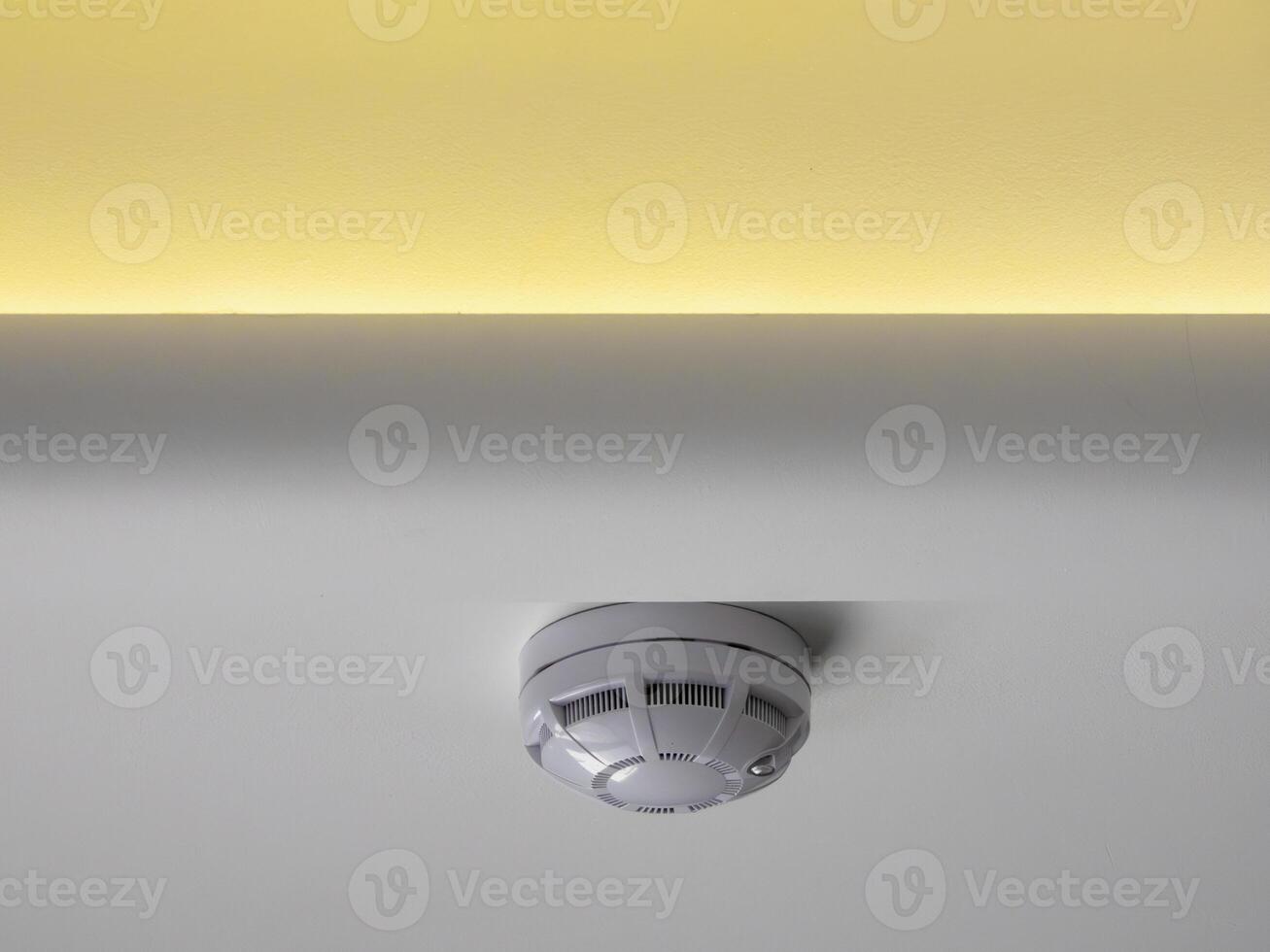 fire alarm sensor on the ceiling with LED lighting photo