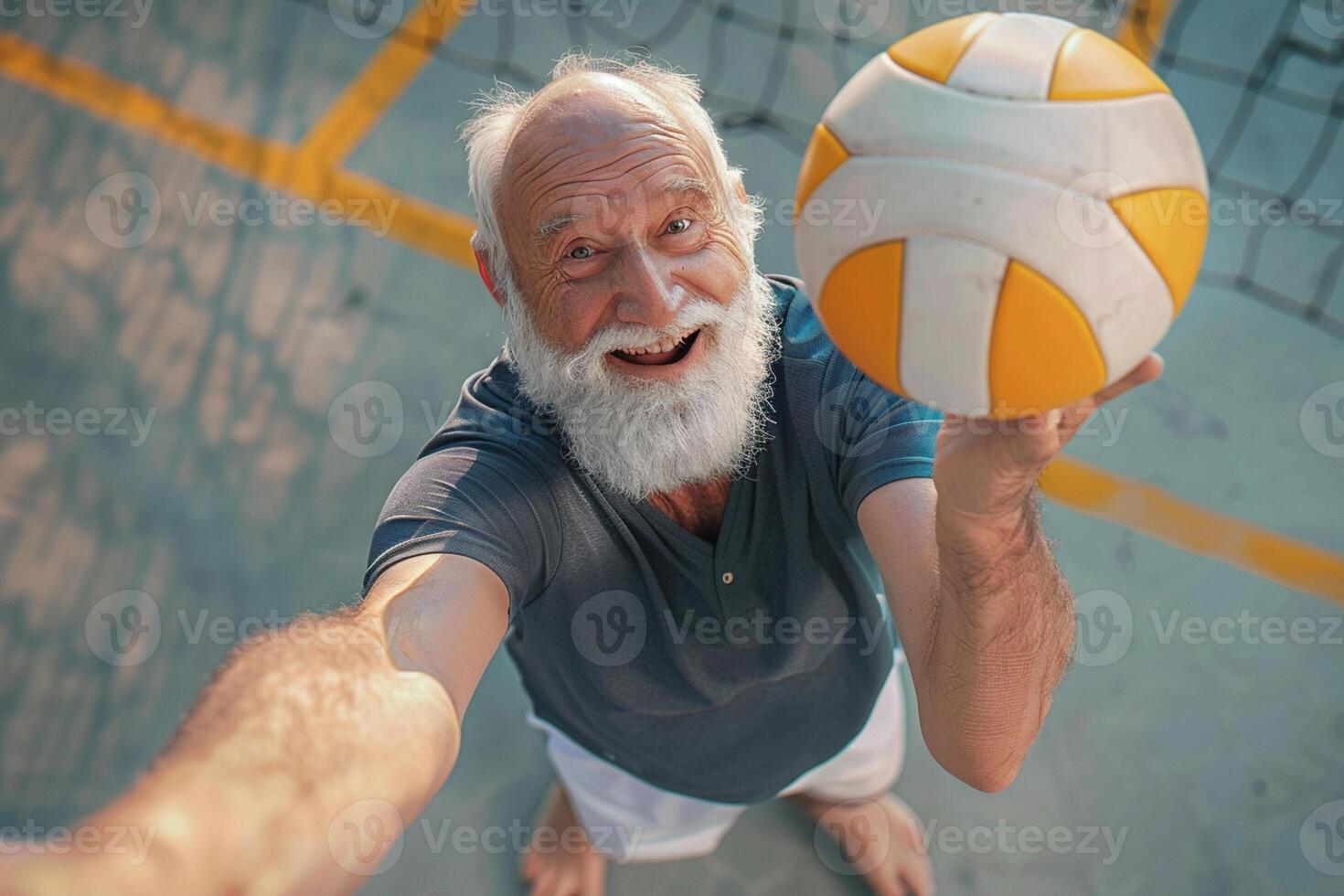 Active sports grandfather plays volleyball. Old timeless active life concept. photo
