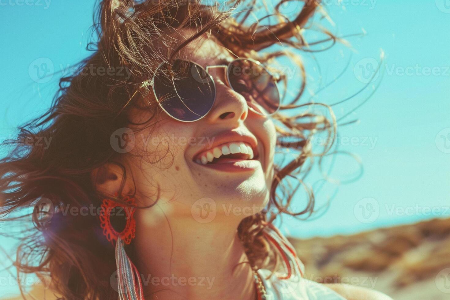 Happy woman enjoying the moment, smiling face, wind is in the hair, sun shining on the face. Bucket lifestyle concept. photo