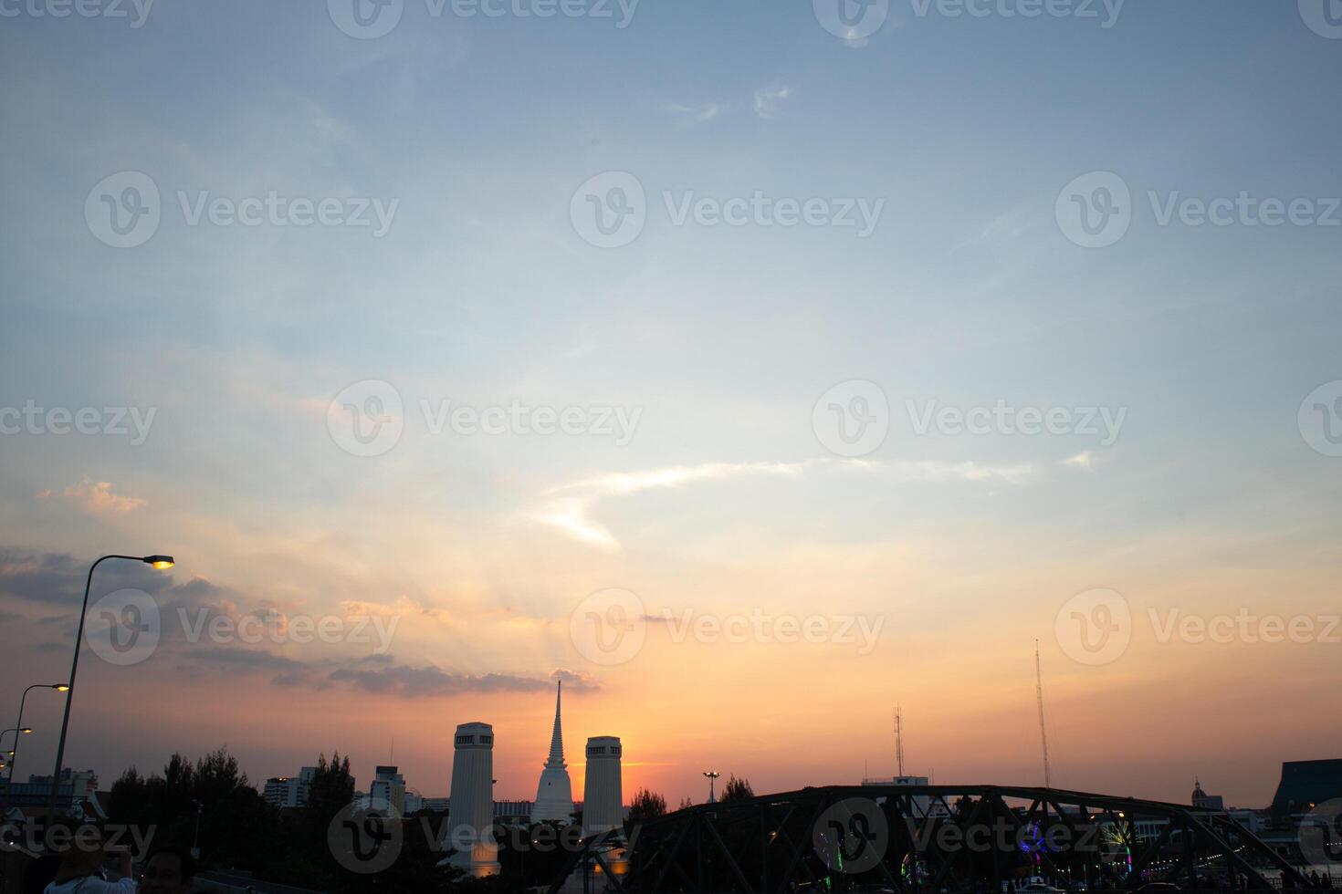 orange blue skyscape background with cloud and silhouette city town building in evening of the day sunset twilight dusk time photo