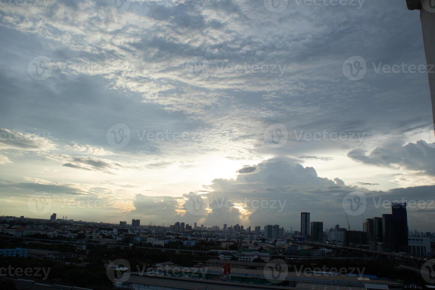orange blue skyscape background with cloud and silhouette city town building in evening of the day sunset twilight dusk time photo