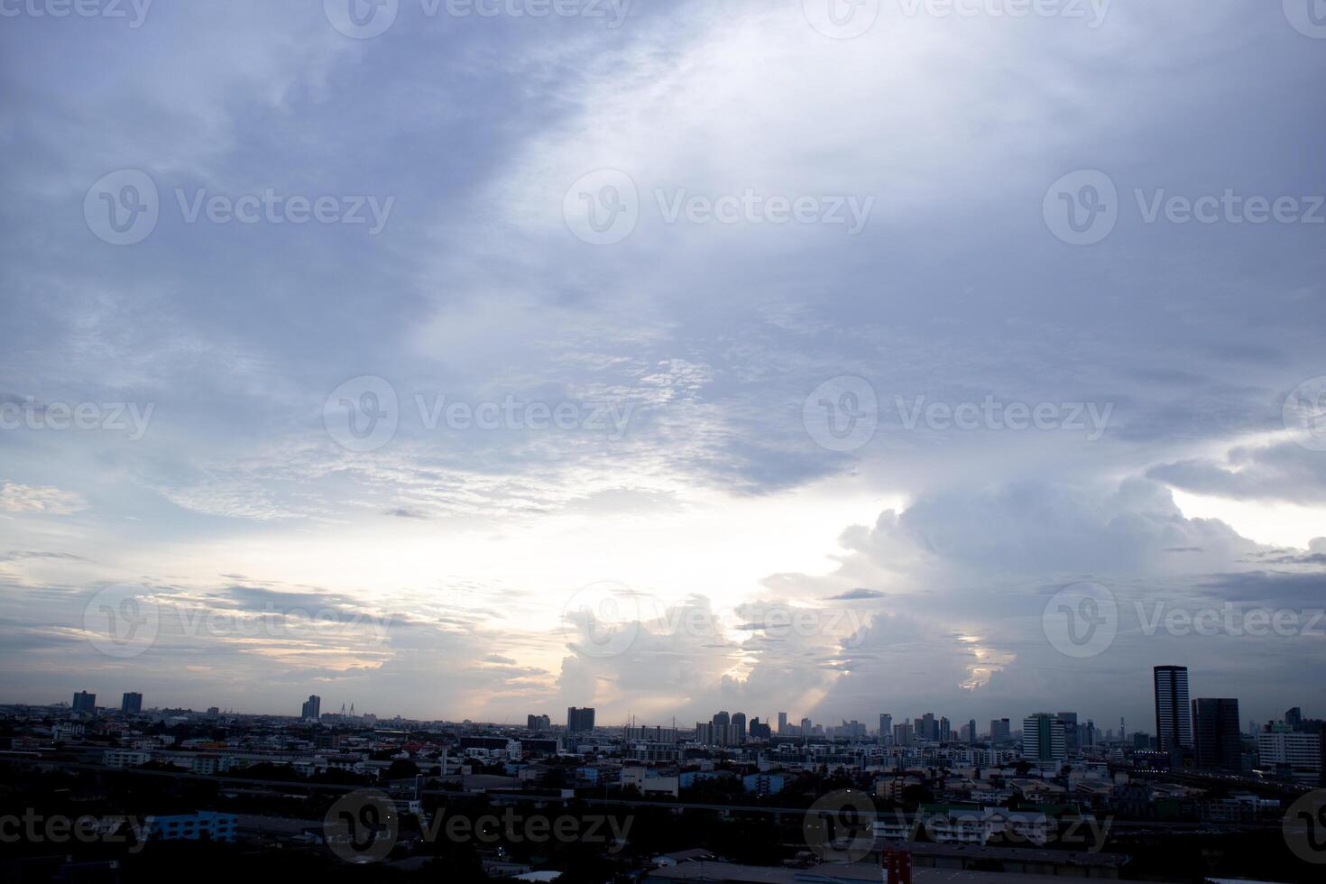 orange blue skyscape background with cloud and silhouette city town building in evening of the day sunset twilight dusk time photo