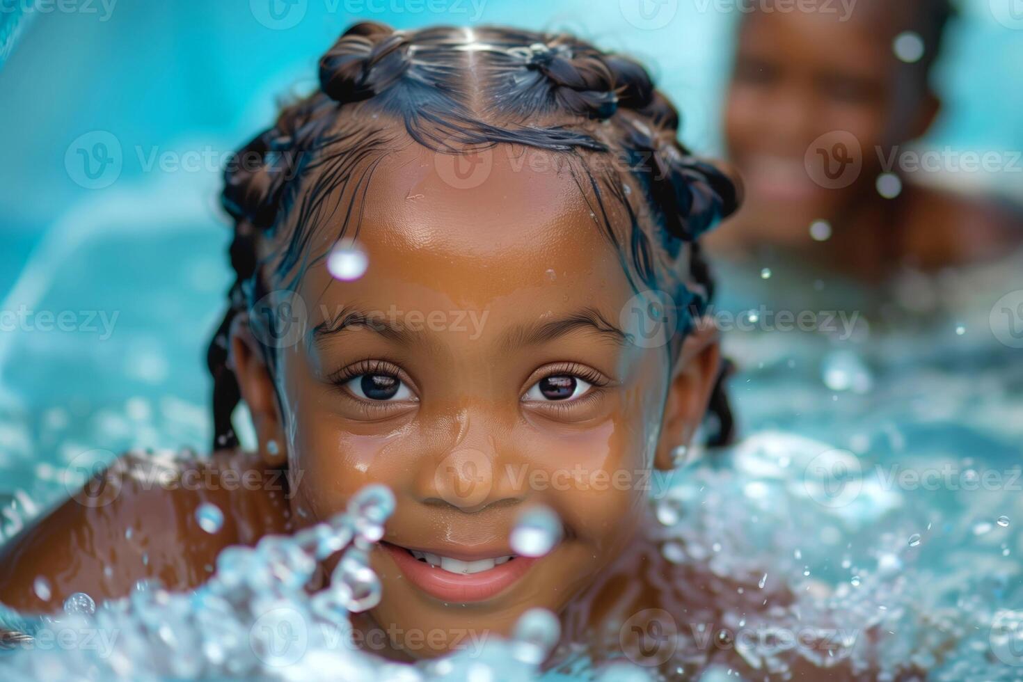 Portrait of a cute african american little girl in swimming pool photo