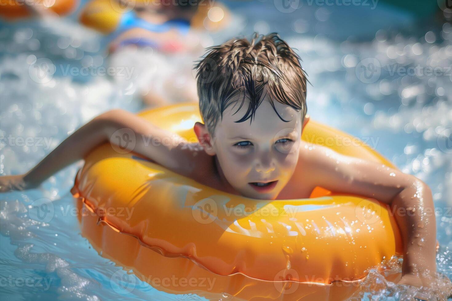 Kid swims in pool with inflatable ring photo