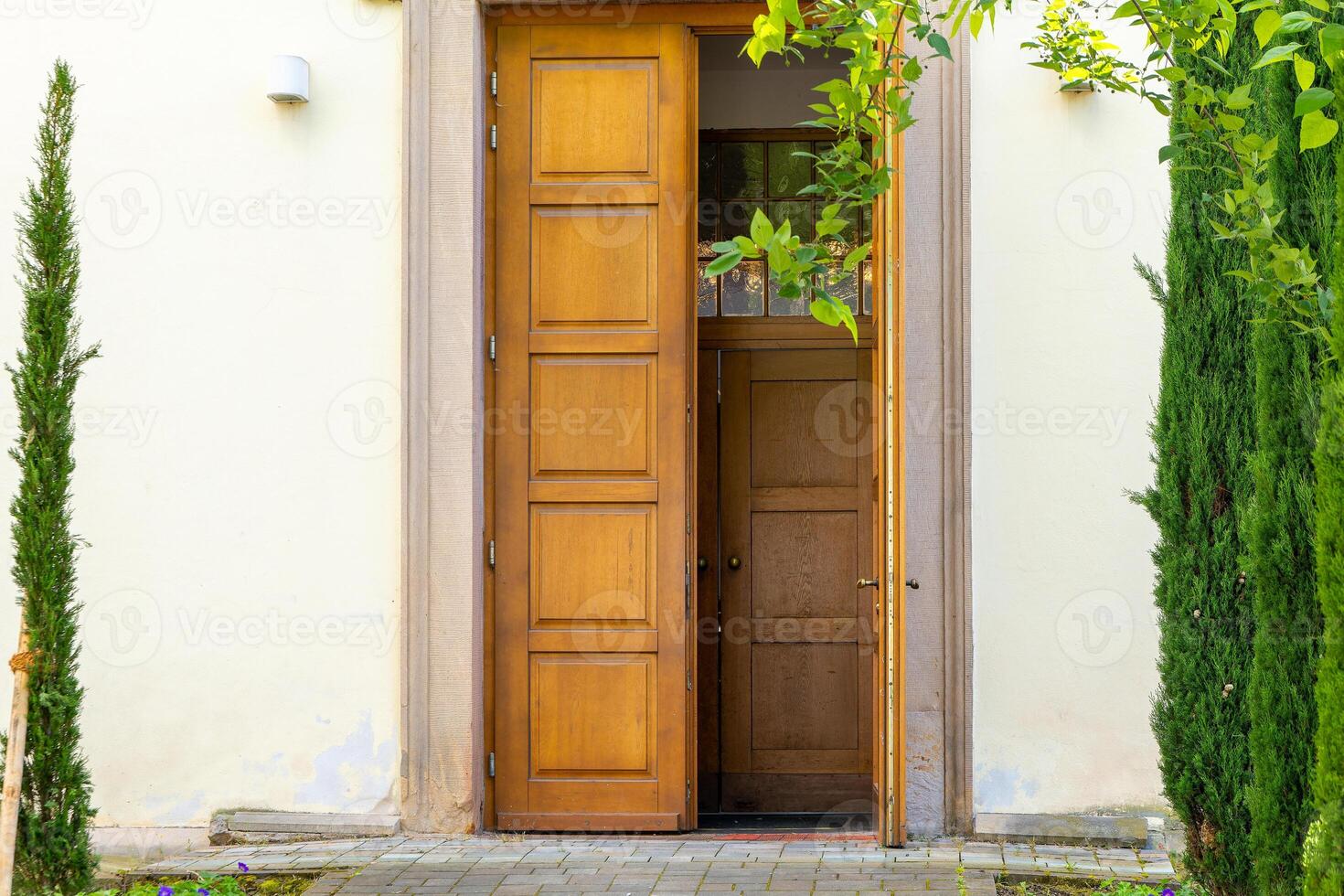 door is open and the door frame is made of wood photo