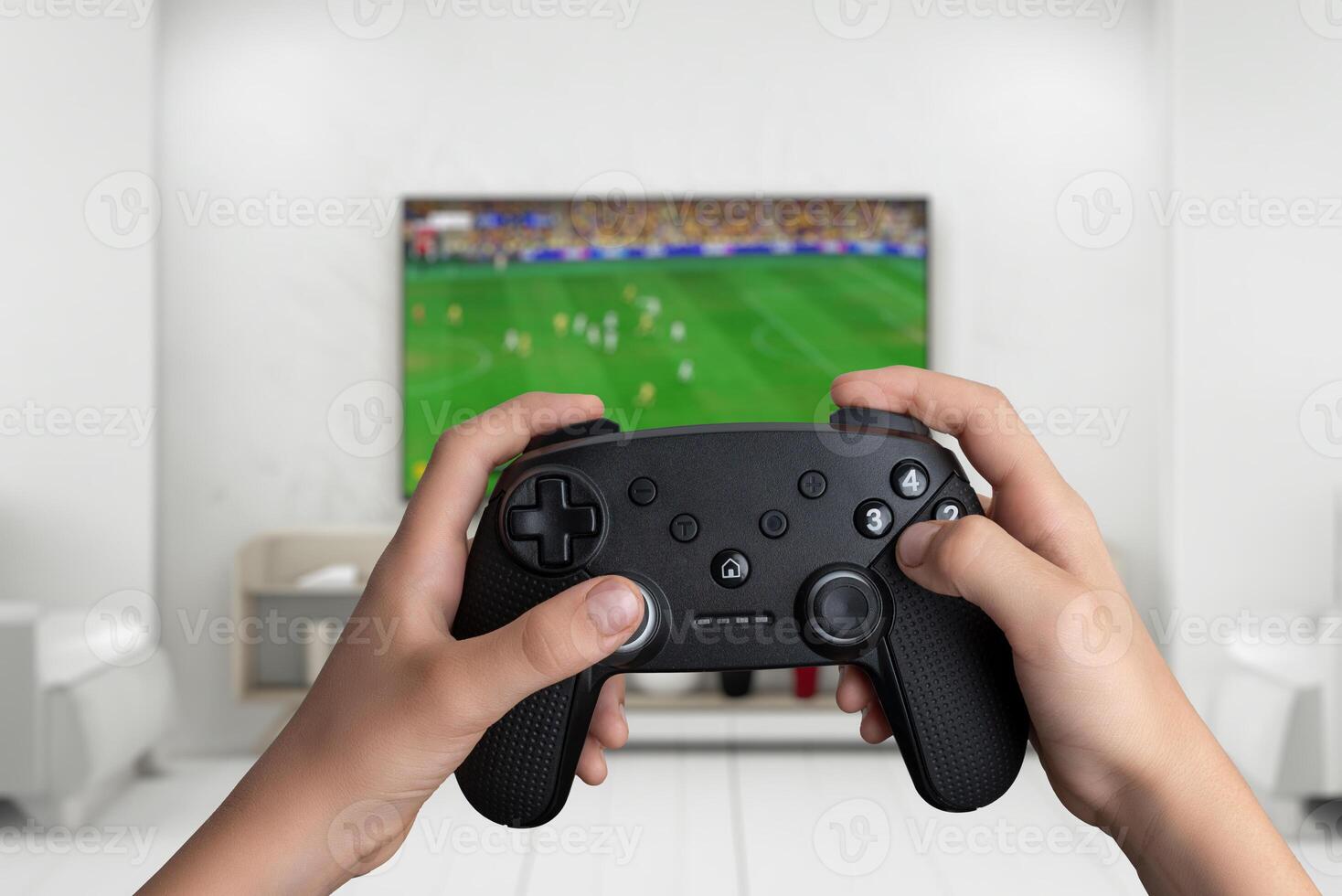 Hands holding a gamepad, playing a soccer game on a big TV screen. Perfect for gaming, sports, and entertainment concept photo