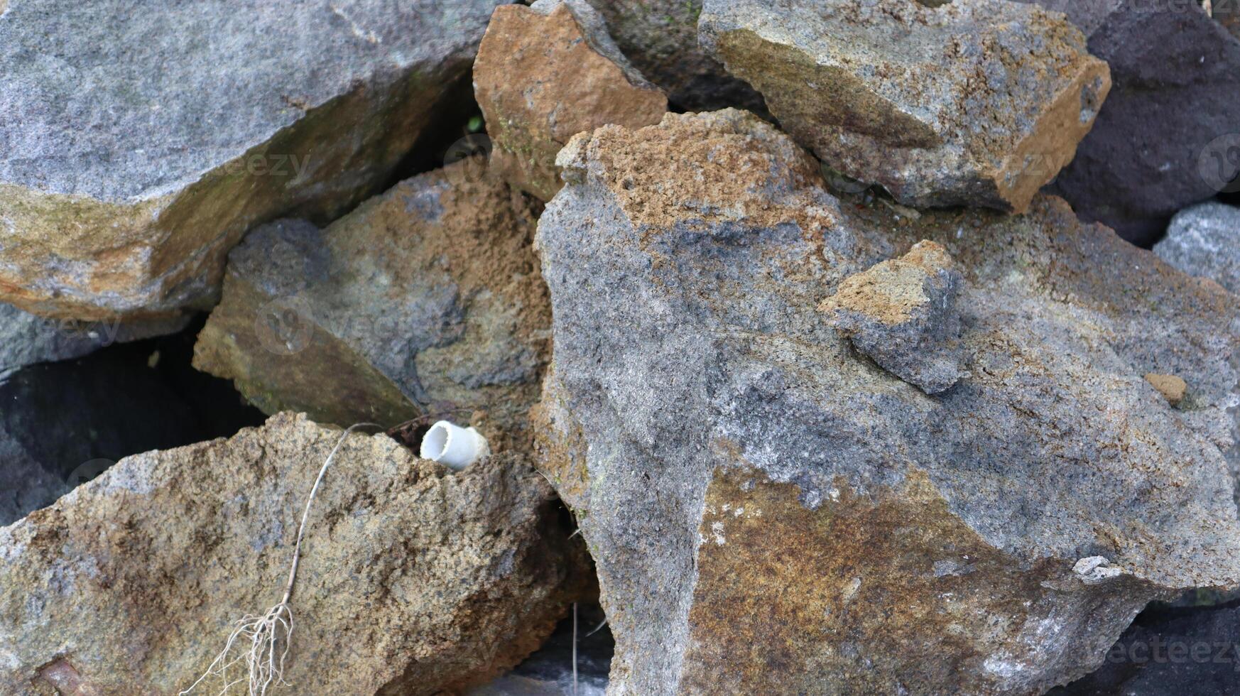 close up texture of rock fragments and soil as background photo