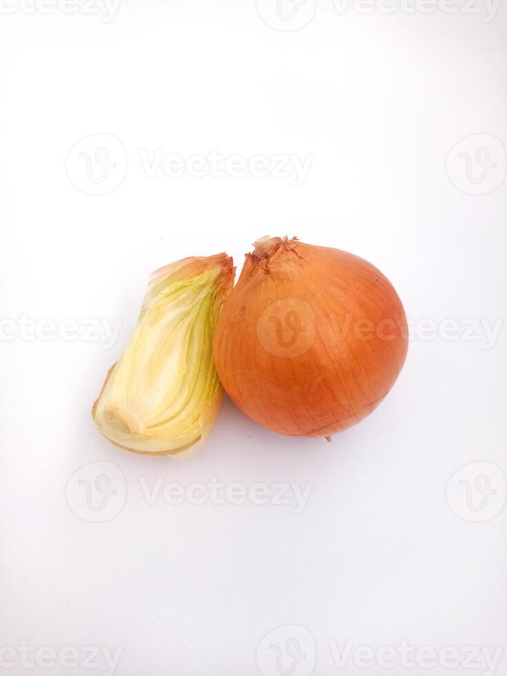 Close up image of a whole, unpeeled onion next to chopped onions. photo