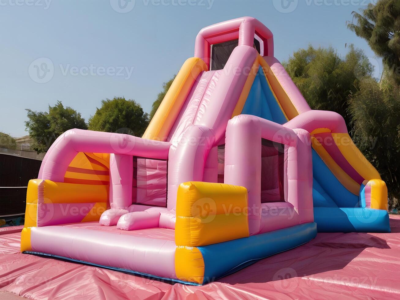 Inflatable colorful bounce house water slide in the backyard. photo