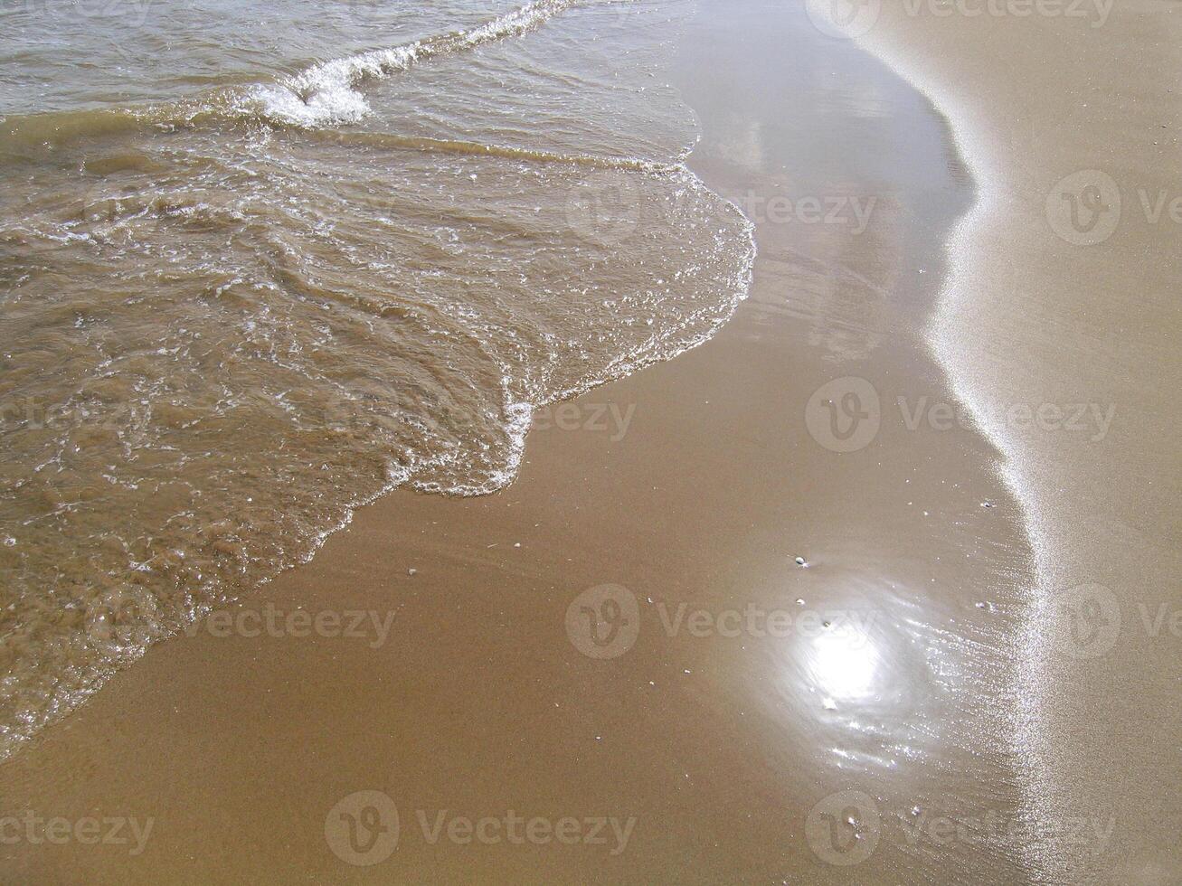 Wave on sand background photo