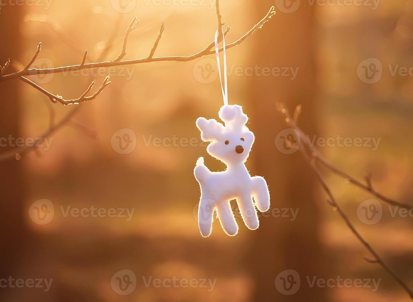 Christmas toy white deer hanging on tree branch outdoors photo