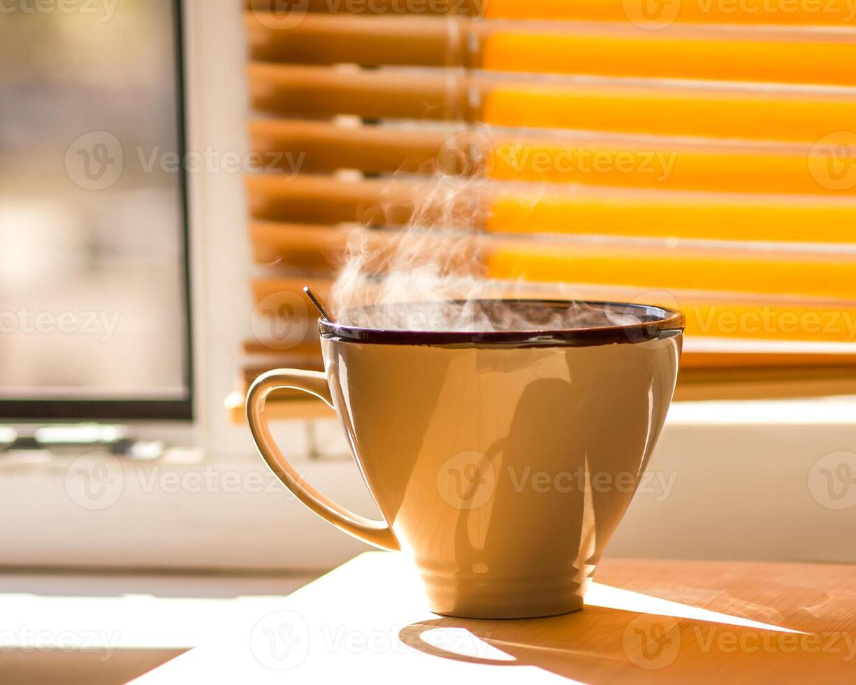 Cup of Coffee on a window sill photo