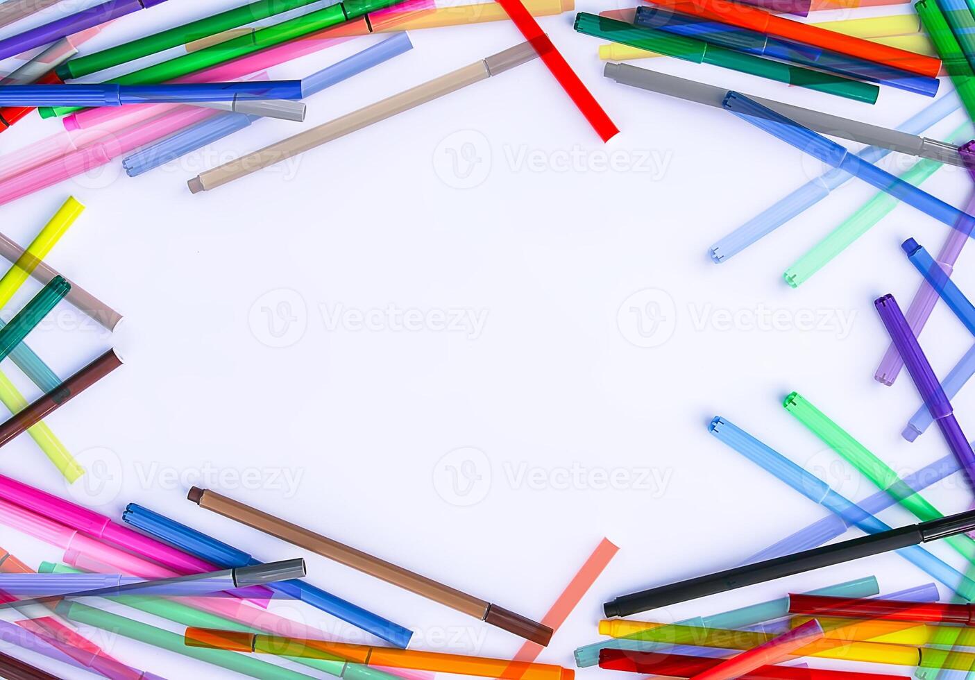 School supplies. Back to School design elements. Colorful markers and white empty paper sheet. photo