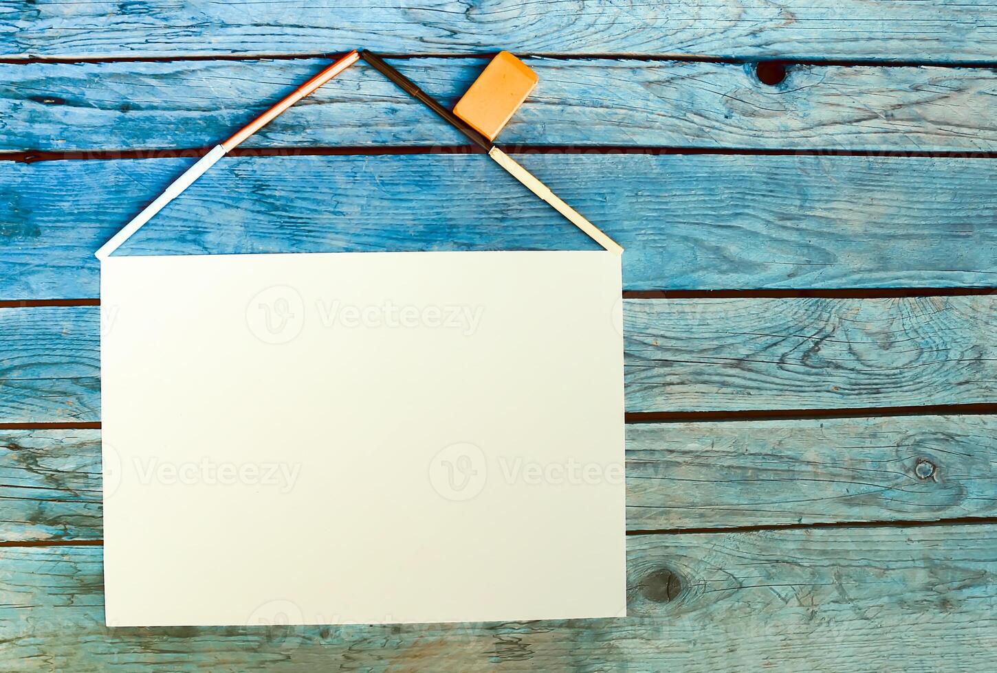 School supplies. Back to School design elements. Colorful markers and white empty paper sheet. photo