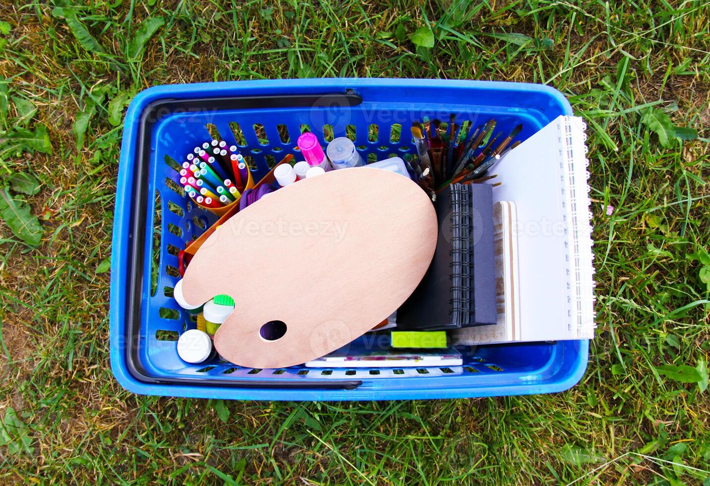 School supplies in shopping cart. Back to School design elements. photo