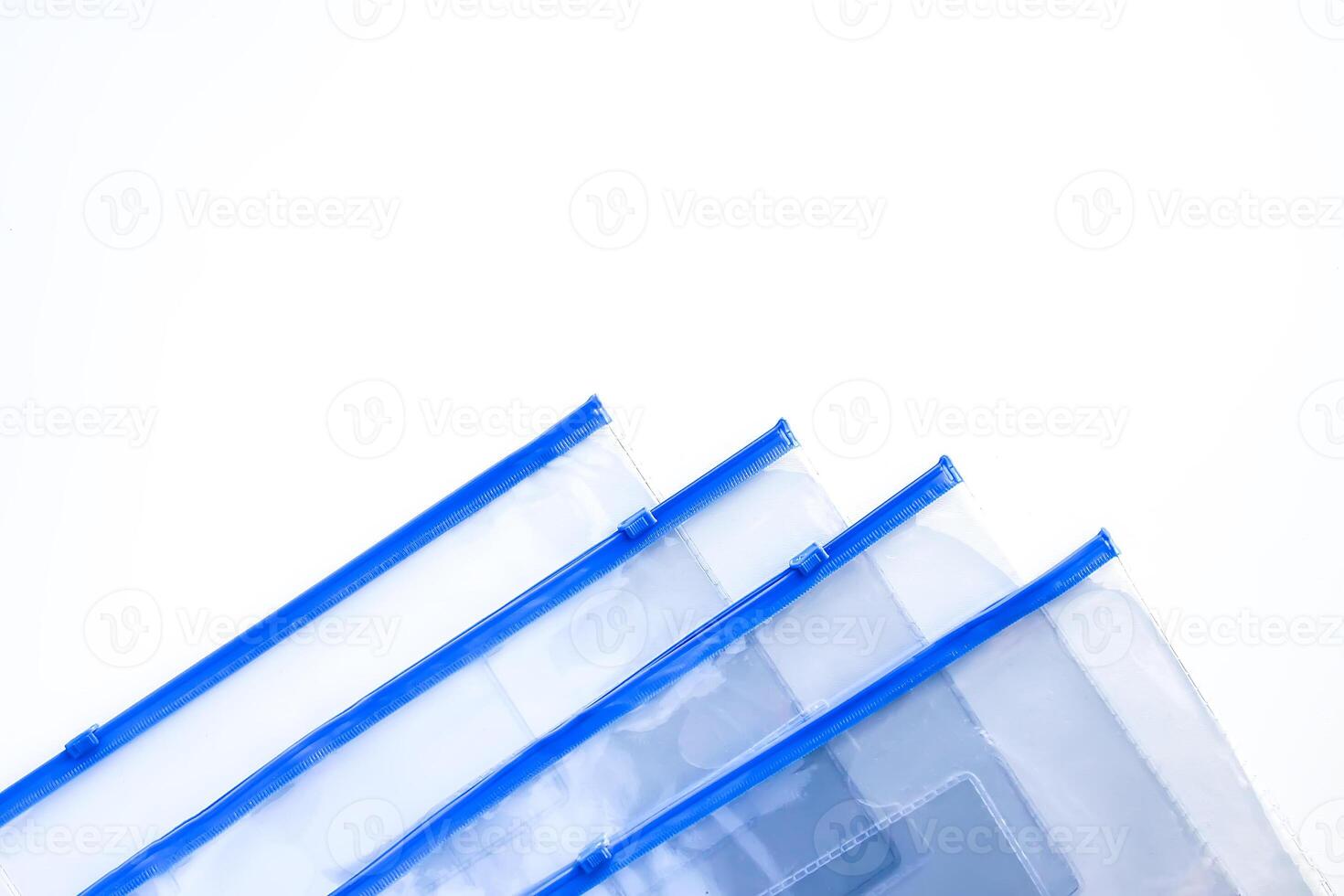 Transparent plastic zipper bags on soft light background photo