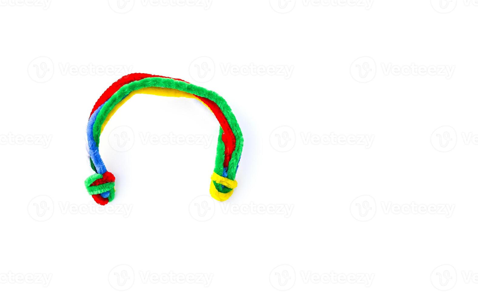 Soft wire in the shape of the rainbow on white background photo
