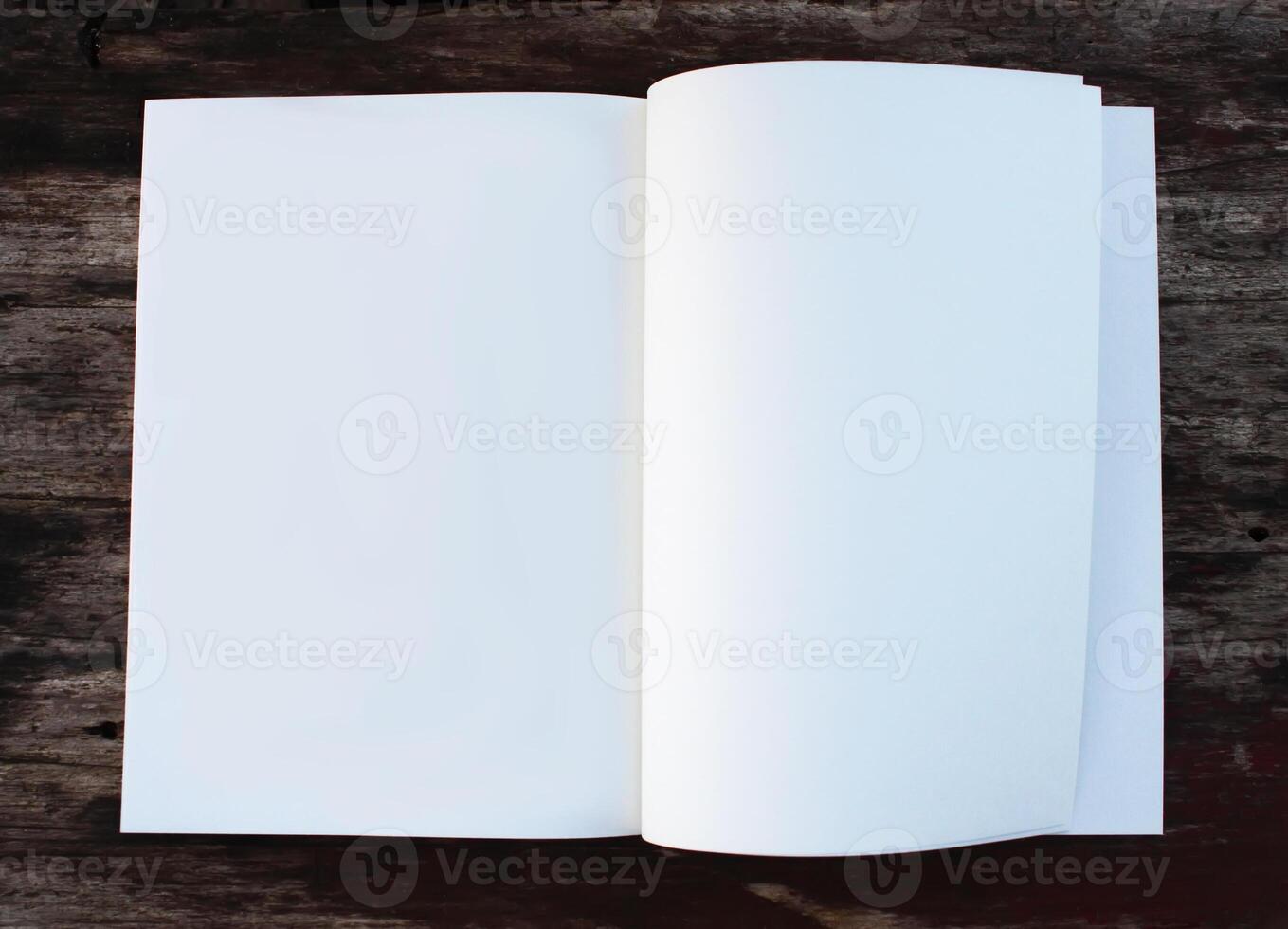 White paper sheet on the wooden table outdoors photo