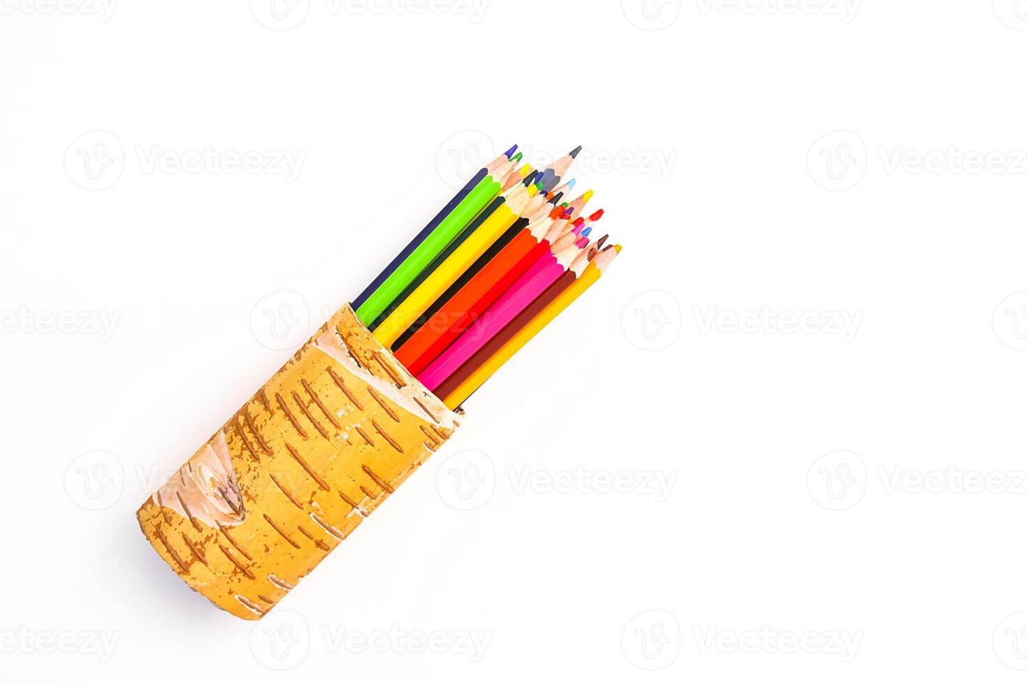 Color pencils in a birch bark organiser photo