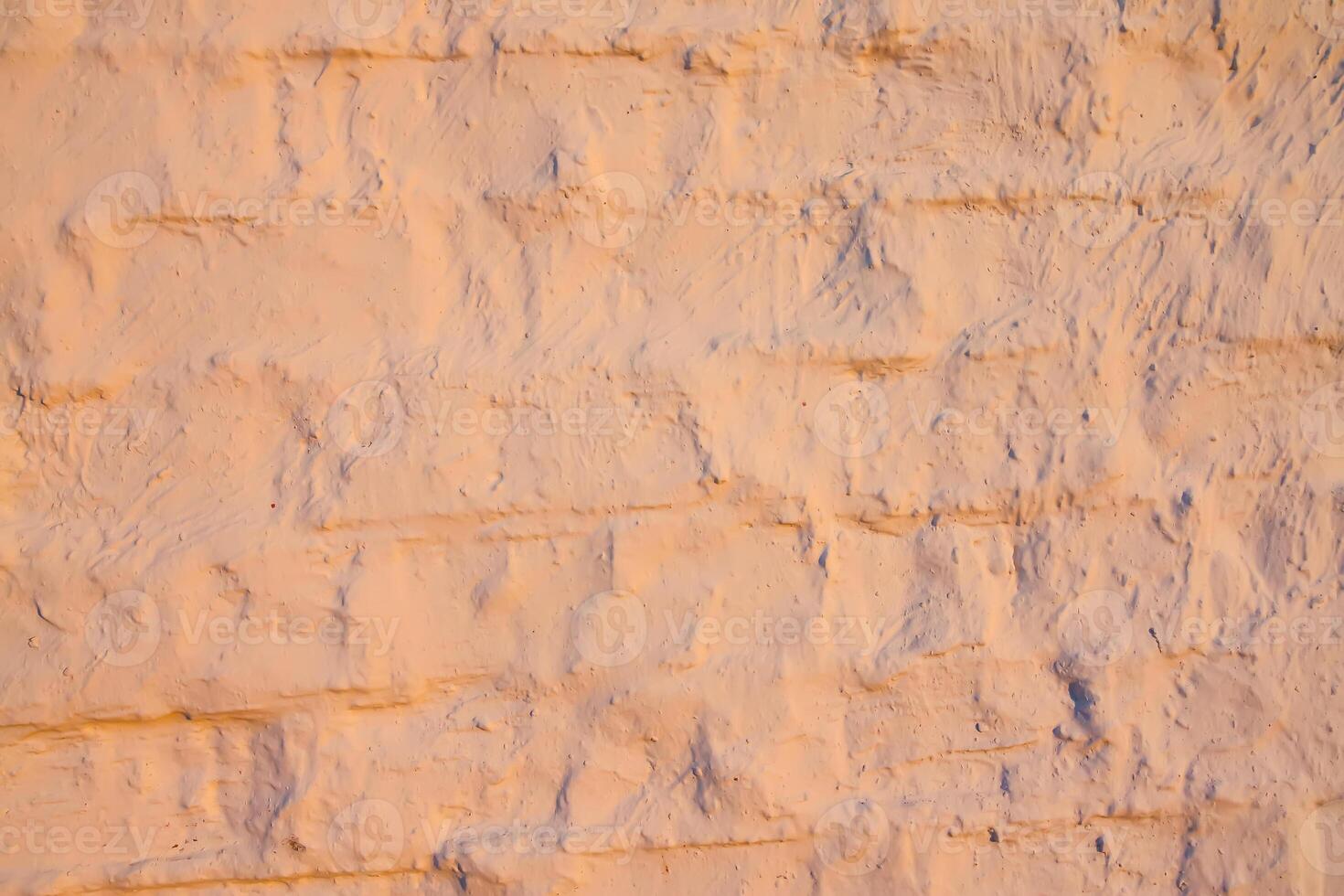 A wall of old bricks. Weathered surface. photo