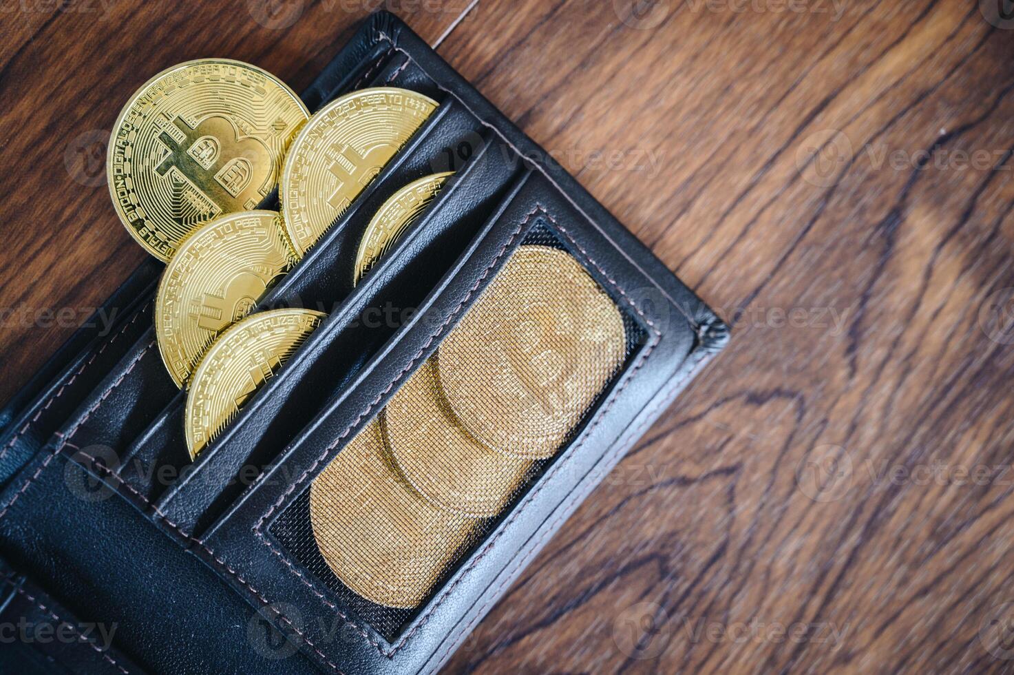 Group of Bitcoin token in leather wallet. Bitcoin is one of the popular cryptocurrency, a virtual currency or a digital currency. photo