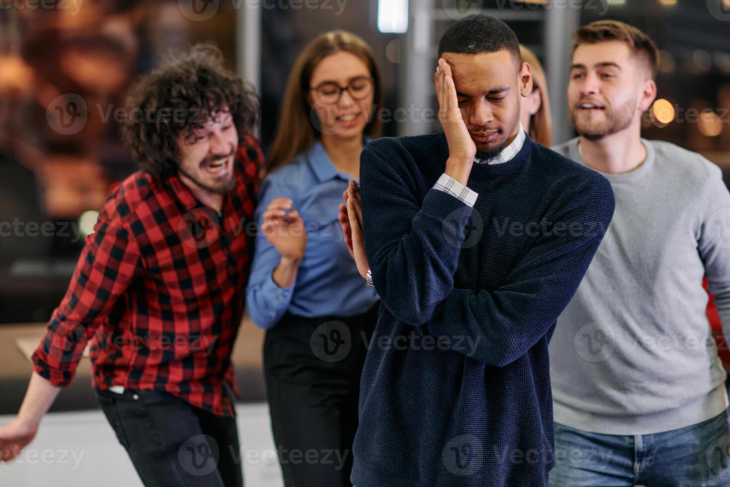 A group of young business people have fun playing interesting games while taking a break from work in a modern office. Selective focus photo