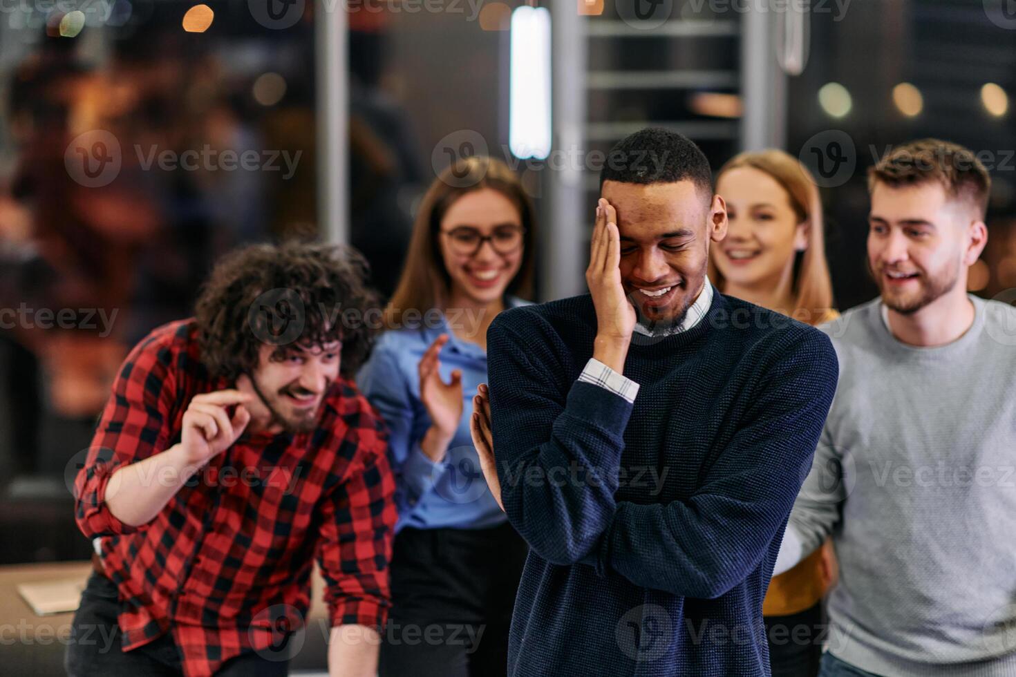 A group of young business people have fun playing interesting games while taking a break from work in a modern office. Selective focus photo