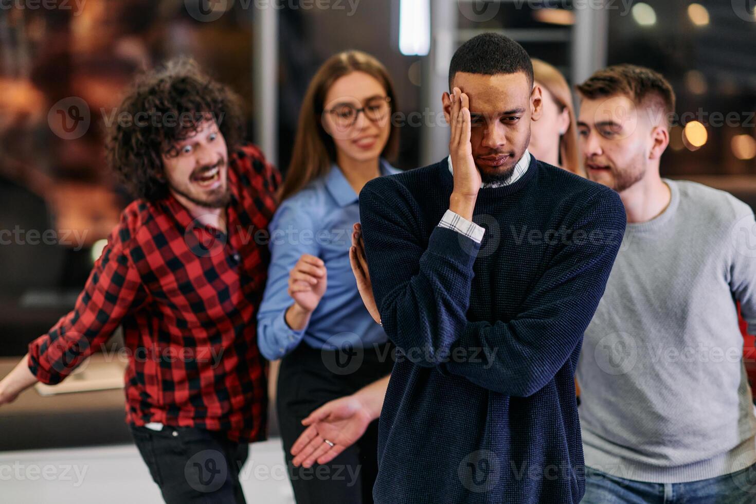 A group of young business people have fun playing interesting games while taking a break from work in a modern office. Selective focus photo