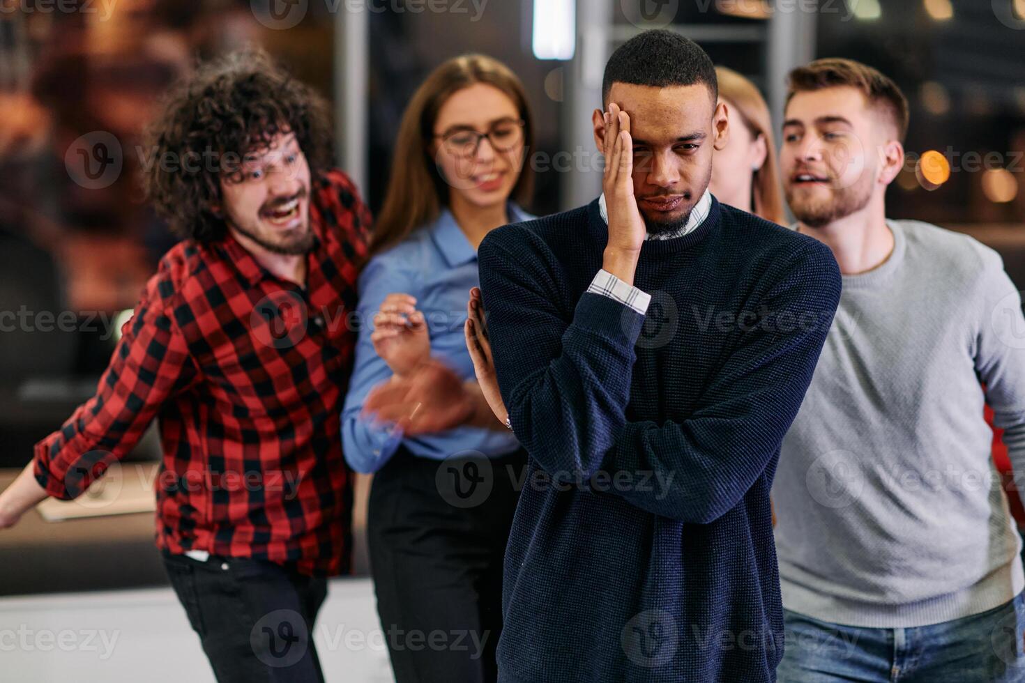 A group of young business people have fun playing interesting games while taking a break from work in a modern office. Selective focus photo