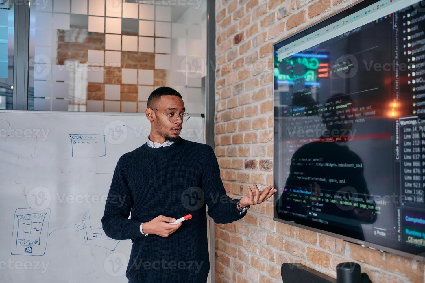 African American businessman delivers a compelling presentation of his business strategy to his colleagues, fostering collaboration and forward thinking photo