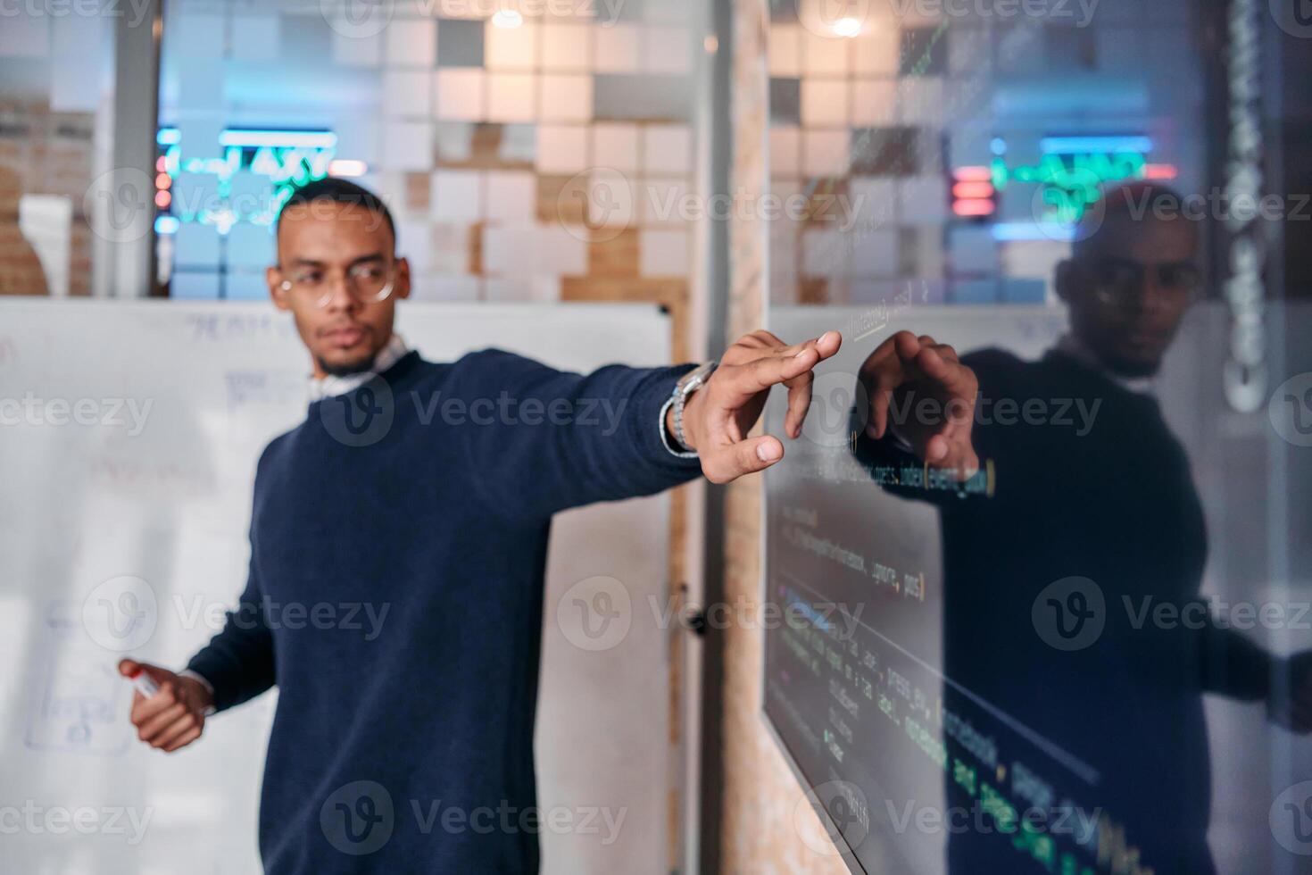 African American businessman delivers a compelling presentation of his business strategy to his colleagues, fostering collaboration and forward thinking photo