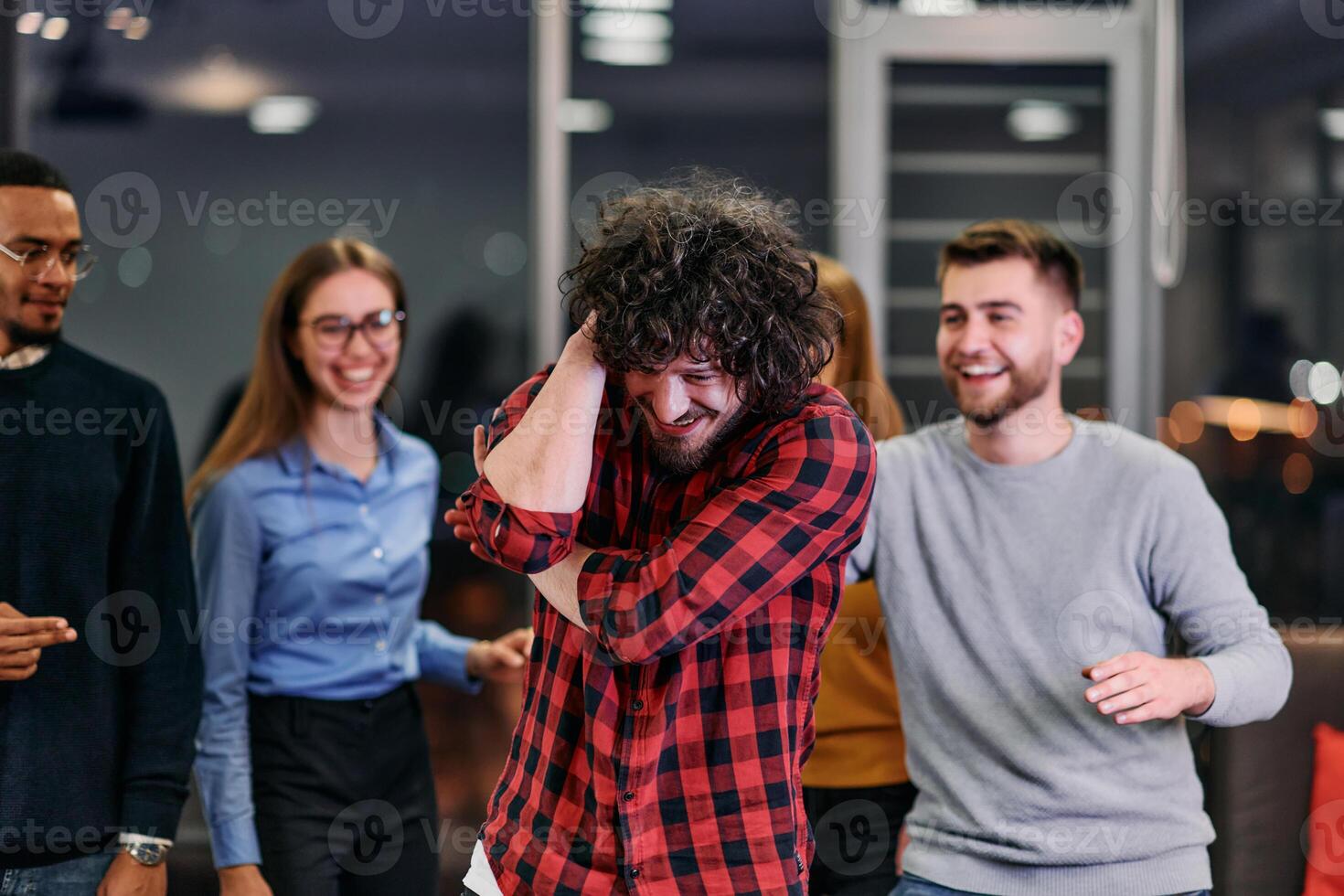 A group of young business people have fun playing interesting games while taking a break from work in a modern office. Selective focus photo