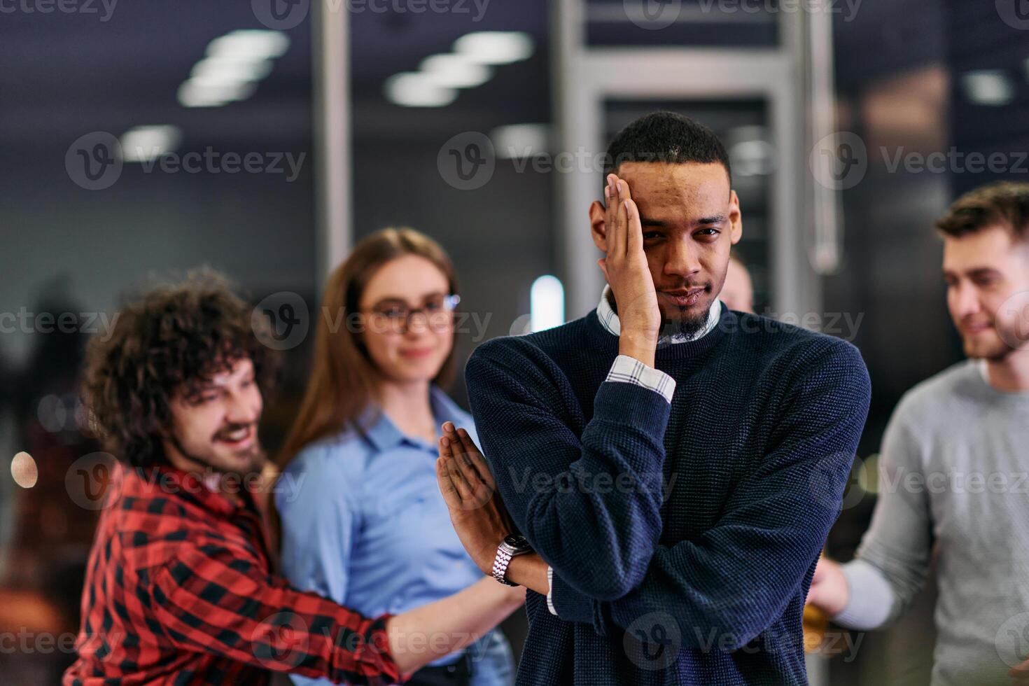 A group of young business people have fun playing interesting games while taking a break from work in a modern office. Selective focus photo