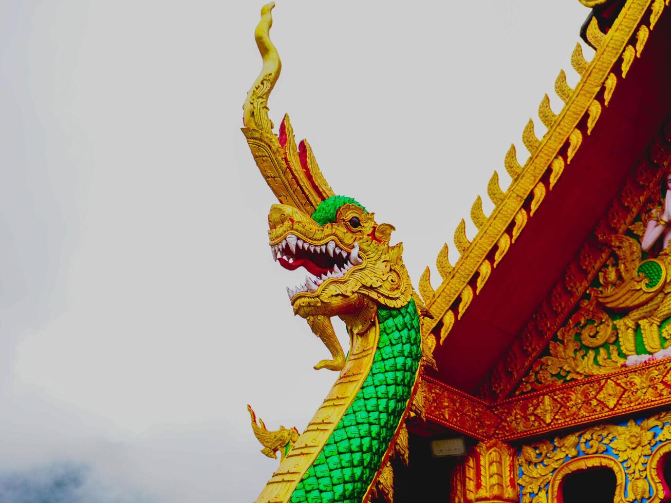 Beautiful sculptures at Sapan Temple in the middle of a valley surrounded by nature in Nan Province, Thailand. photo