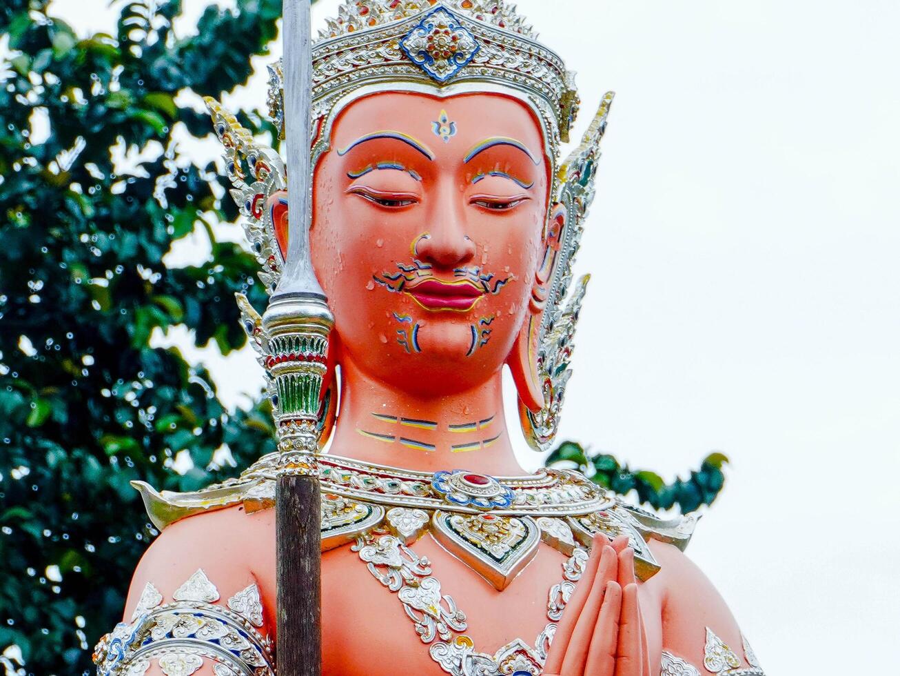 Buddha statues and sculptures at Wat Sapan in the middle of a valley surrounded by nature in Nan Province, Thailand. photo