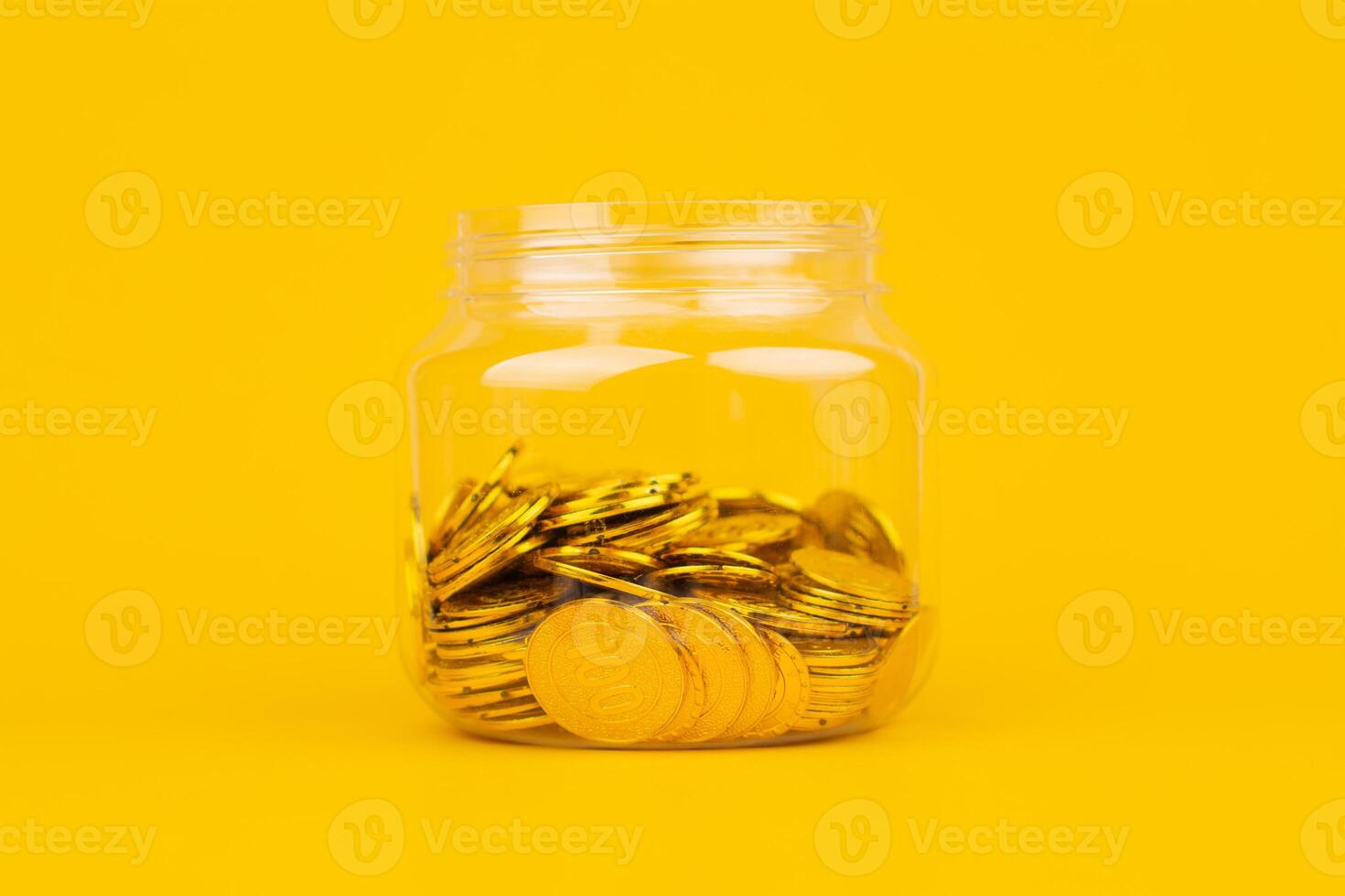 Gold coins on a yellow background, investing in gold Stock market and financial growth photo