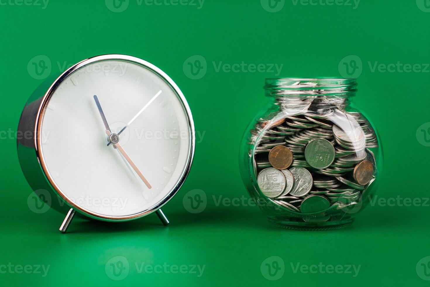 Saving coins in a glass jar creates a good financial and investment asset. Financial growth and investment returns photo