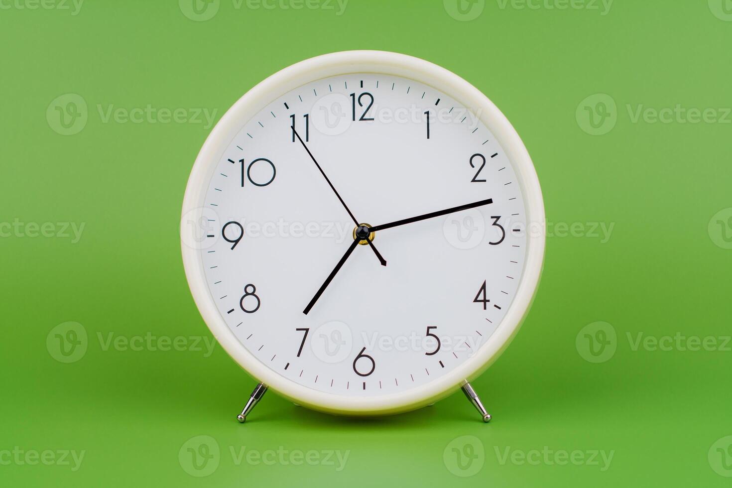 Time and the law of time, the limits of work, a stationary hand, studio photography, time concept. photo