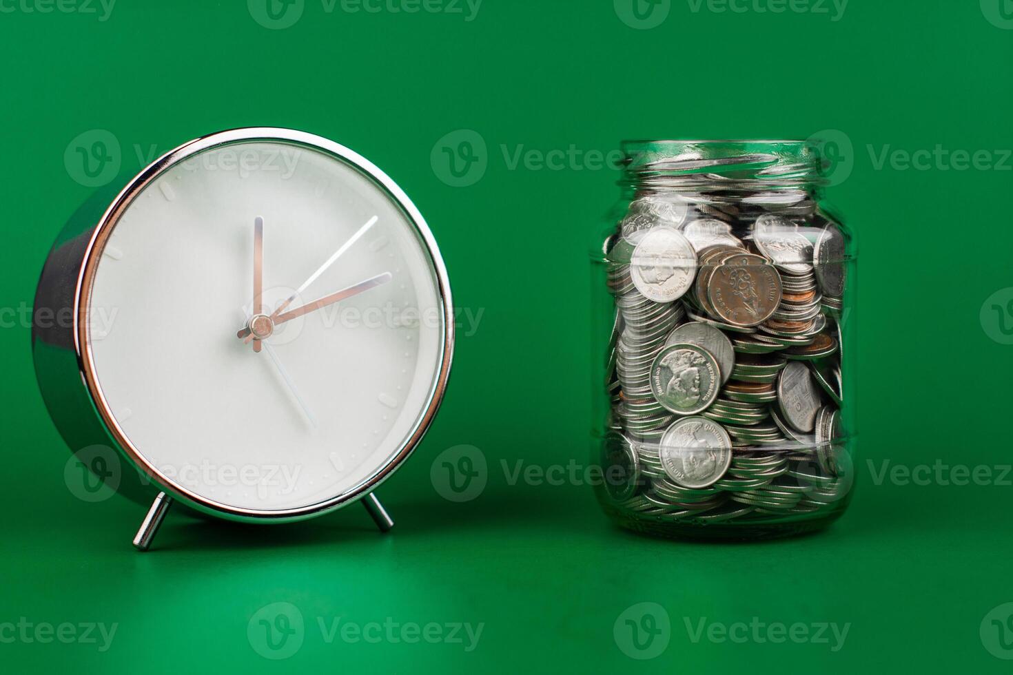 Saving coins in a glass jar creates a good financial and investment asset. Financial growth and investment returns photo