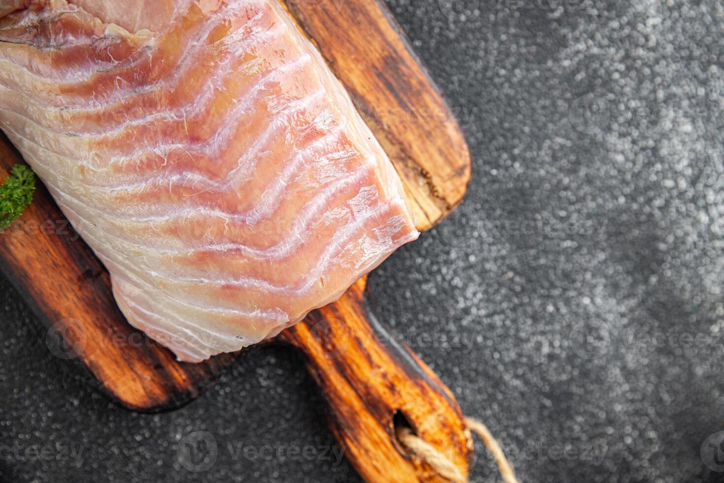 raw fish fillet seafood ready to cook natural fresh appetizer meal food snack on the table copy space food background rustic top view keto or paleo diet vegetarian food Pescetarian photo