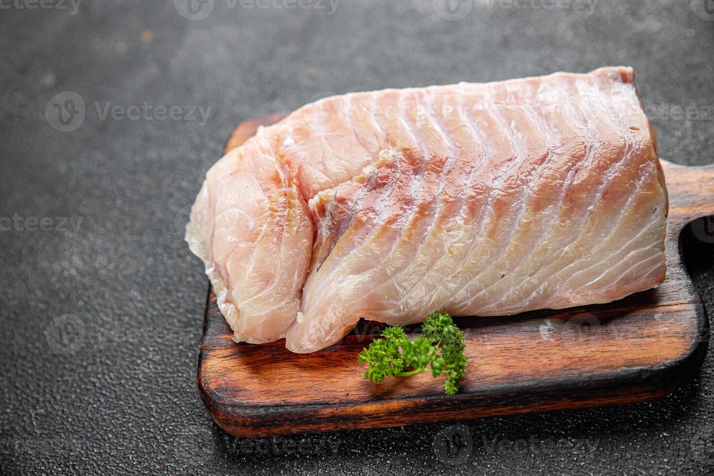 raw fish fillet seafood ready to cook natural fresh appetizer meal food snack on the table copy space food background rustic top view keto or paleo diet vegetarian food Pescetarian photo
